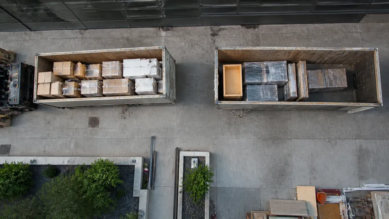 Overhead view of open containers holding cartons and wrapped items